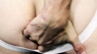 Solo gay gently fingers himself before riding huge dildo