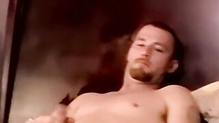 Bearded amateur guy smokes while having his dick blown
