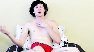 Twink tugs on his massive cock and uses dildo on his ass
