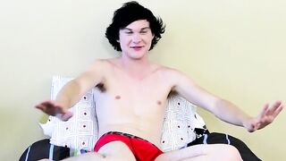 Twink tugs on his massive cock and uses dildo on his ass