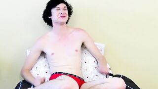 Twink tugs on his massive cock and uses dildo on his ass