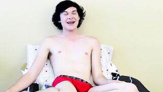 Twink tugs on his massive cock and uses dildo on his ass