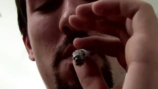Attractive Paradox chainsmokin marlboro black while jerking his cock passionately