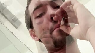 Attractive Paradox chainsmokin marlboro black while jerking his cock passionately