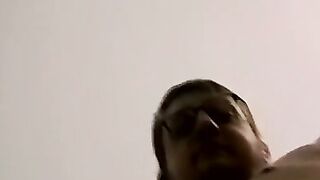 Tattooed amateur with glasses is stroking his massive dick