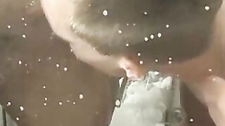 Tattooed twink KC Williams swallows throbbing cock in shower