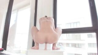 Squirting near the window for her partner
