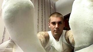 Stunning young jock Evan Heinze plays with his delicious dick using his sexy feet