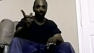 Ebony male strips to reveals his fat cock and plays with it