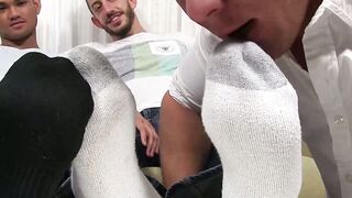 Gay guys and their feet are worshiped through socks by hunk