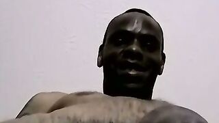 Black dude masturbates on the floor waiting for cum spray