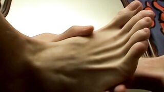 Lovely Gauge jerks off his long shaft while playing with his sexy feet