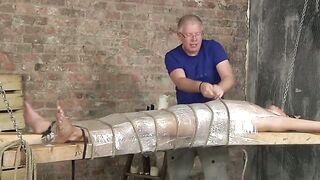 Bound young twink enjoys handjob from mature master