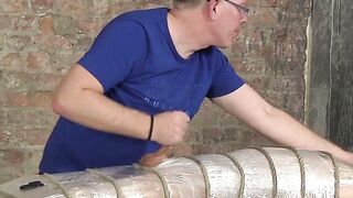 Bound young twink enjoys handjob from mature master