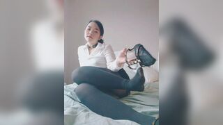 oriental secretary stripping off and masturbating on camera