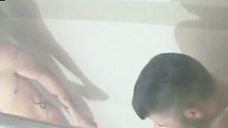 Young men are stroking their giant cocks under the shower