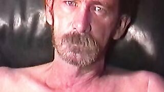 Rugged stud strips naked to tease with his throbbing dick