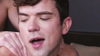 Inked young man rides a massive cock while masturbating