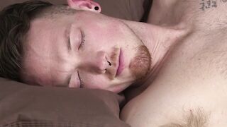 Young man is dreaming while his lover worships his feet