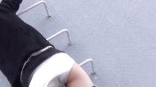 Young Asian cutie outdoors tied up and pees from the ladders