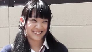 Little Japanese schoolgirl toys pussy over panties in public