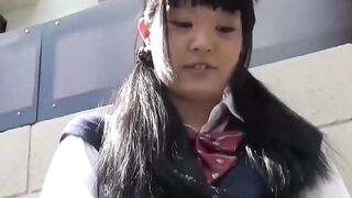 Little Japanese schoolgirl toys pussy over panties in public
