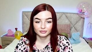 Redhead amateur babe shows tattoos