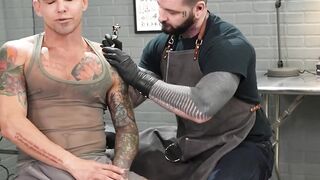 Beefy tattooer Teddy Bryce was anal rimmed and fisted by hung client Archer Croft