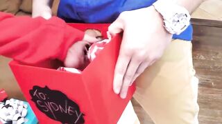 Young blonde duo sucking giftwrapped cock before doggystyle
