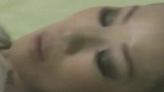 Tiny Japanese babe moistens her panties with pussy juices