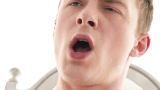 Felix Kamp strokes twink Austin Young cock while ass fingering