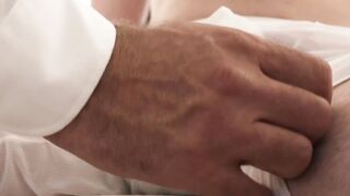Felix Kamp strokes twink Austin Young cock while ass fingering