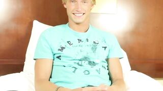 Tanned blond jock plays with dildo and his cock hard for us