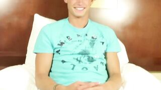 Tanned blond jock plays with dildo and his cock hard for us