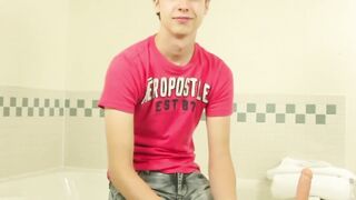 Young pale twink with blonde hair plays with dildo and wanks