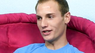 Young man does an interview before playing with his cock