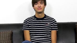 Young dude with bangs pleases himself after the interview