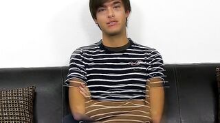 Young dude with bangs pleases himself after the interview