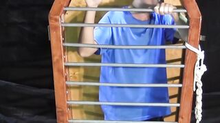 BondageBadBoy.com - BDSM fun with caged dude tormented with hot wax and harsh nipple