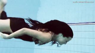 Gypsy african haired beauty swimming underwater