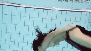 Gypsy african haired beauty swimming underwater