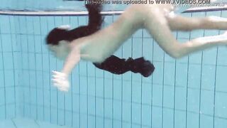 Gypsy african haired beauty swimming underwater