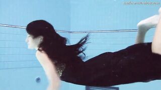 Gypsy african haired beauty swimming underwater