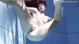 Gypsy african haired beauty swimming underwater