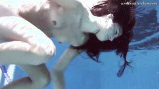 Gypsy african haired beauty swimming underwater