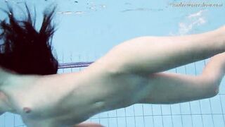 Gypsy african haired beauty swimming underwater