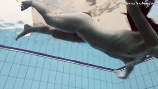 Gypsy african haired beauty swimming underwater