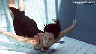 Gypsy african haired beauty swimming underwater