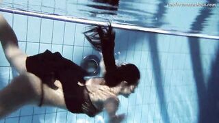 Gypsy african haired beauty swimming underwater