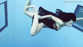 Gypsy african haired beauty swimming underwater